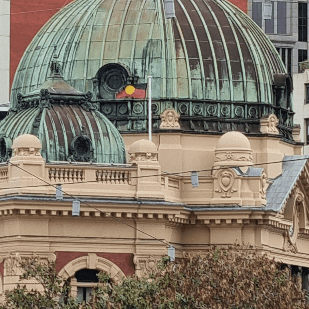 Flinders Street Station with Aboriginal flag